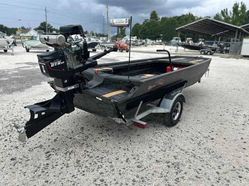 Slide: The Image of 2025 Gator Tail EXTREME MOD-V 1854 boat on trailer in outdoor setting. - 9