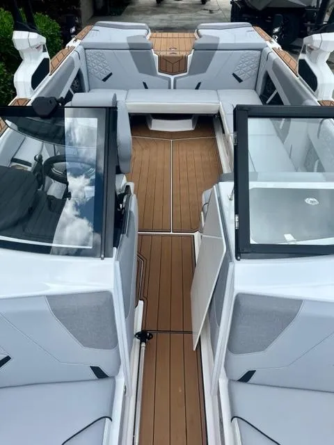 Slide: The Image of 2023 Nautique Super Air Nautique GS22 interior with sleek seating and modern design. - 10