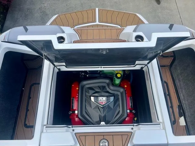 Slide: The Image of 2023 Nautique Super Air Nautique GS22 engine compartment with PCM engine visible. - 13