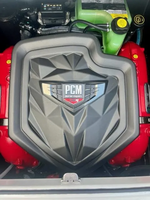 Slide: The Image of 2023 Nautique Super Air Nautique GS22 engine with PCM cover, showcasing modern design. - 14
