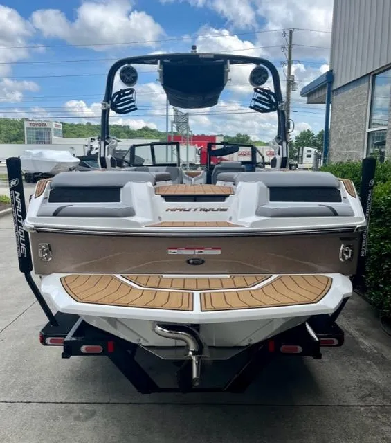 Slide: The Image of 2023 Nautique Super Air Nautique GS22 boat, rear view, parked outdoors. - 4
