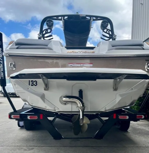 Slide: The Image of 2023 Nautique Super Air Nautique GS22 boat on trailer, rear view. - 5