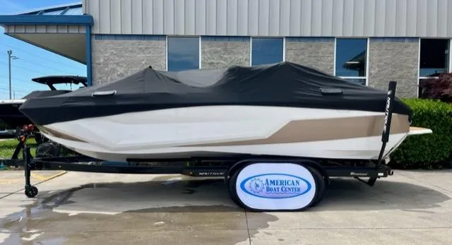 Slide: The Image of 2023 Nautique Super Air Nautique GS22 boat covered on trailer at American Boat Center. - 6
