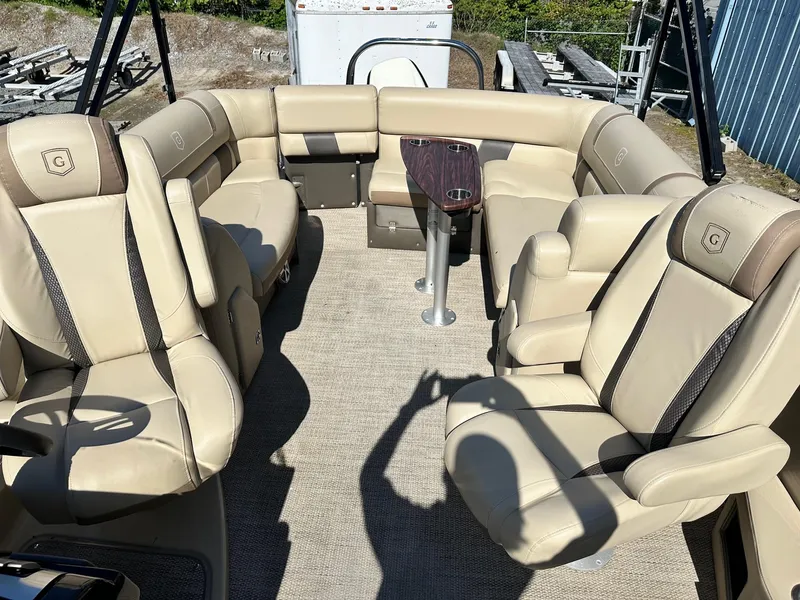 Slide: The Image of Luxurious seating on 2017 Godfrey AQUA PATIO 235UL pontoon boat interior. - 2