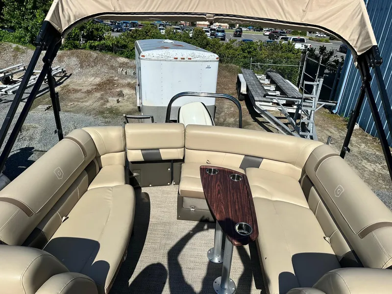Slide: The Image of 2017 Godfrey AQUA PATIO 235UL pontoon boat with beige seating and wood table. - 4