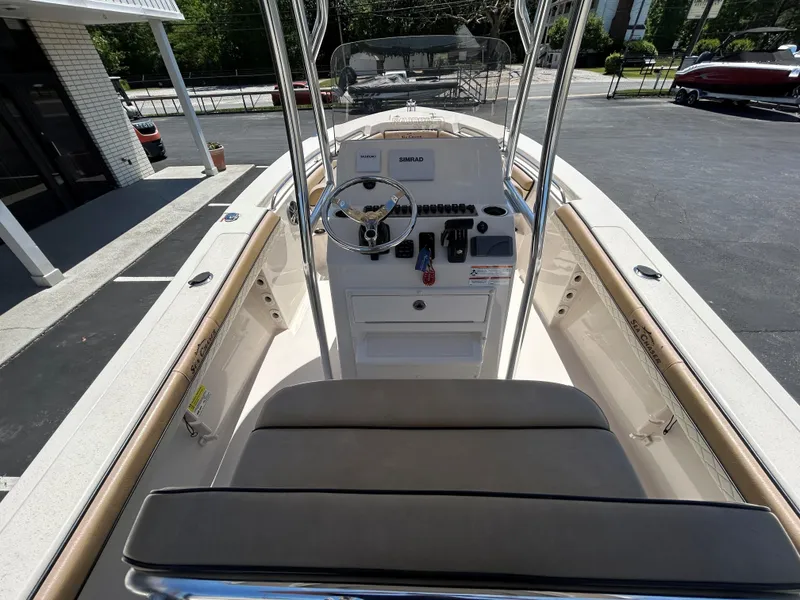 Slide: The Image of 2023 Sea Chaser 22 HFC boat interior with steering console and seating. - 11