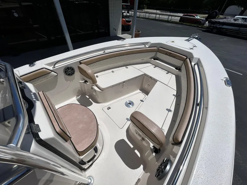 Slide: The Image of 2023 Sea Chaser 22 HFC boat interior with cushioned seating and storage compartments. - 13