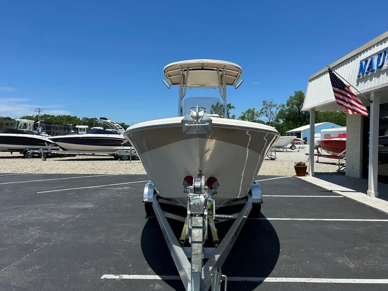Slide: The Image of 2023 Sea Chaser 22 HFC boat on trailer in parking lot, sunny day. - 2