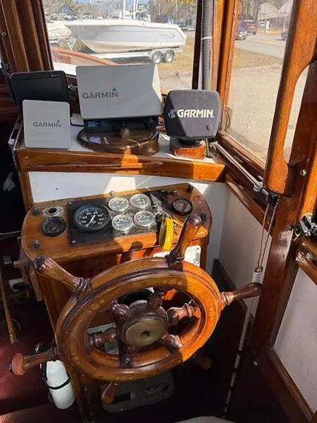 Slide: The Image of Wooden helm of 1999 Glen-L BO-JEST with Garmin navigation devices. - 12