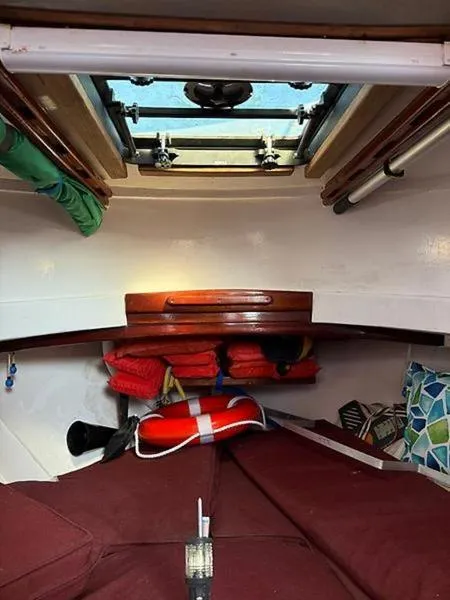 Slide: The Image of Interior of 1999 Glen-L BO-JEST boat with life jackets and hatch. - 13