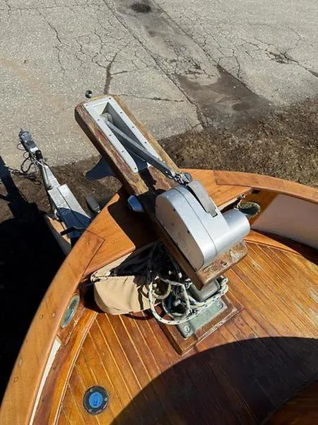 Slide: The Image of 1999 Glen-L BO-JEST boat with wooden deck and metal winch. - 15