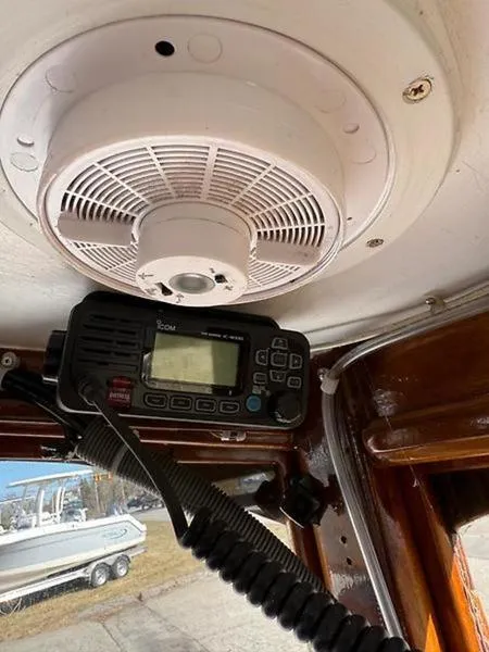 Slide: The Image of 1999 Glen-L BO-JEST boat interior with radio and ceiling fan. - 21