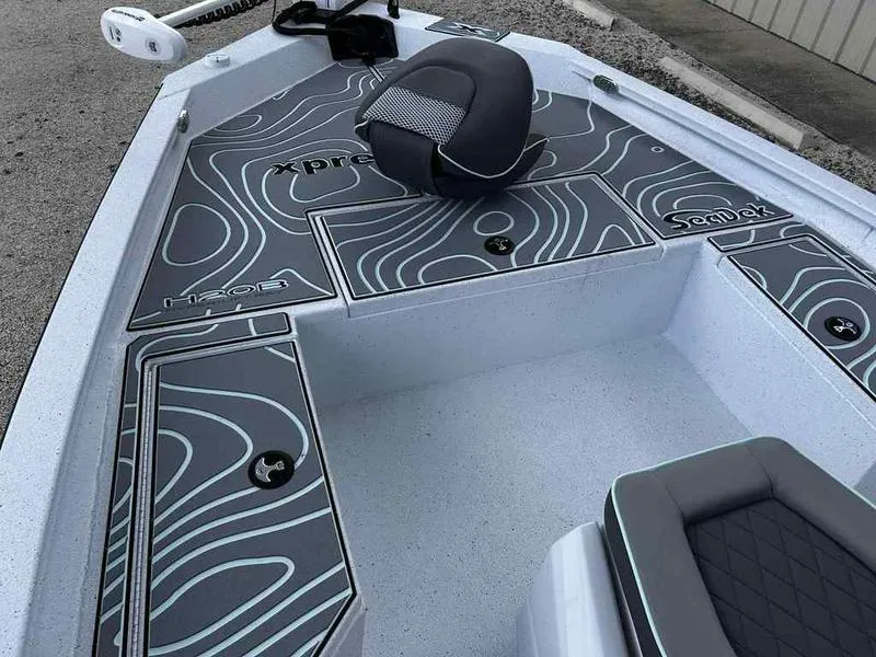 Slide: The Image of 2025 Xpress H20 BAY boat interior with stylish seating and modern design. - 12