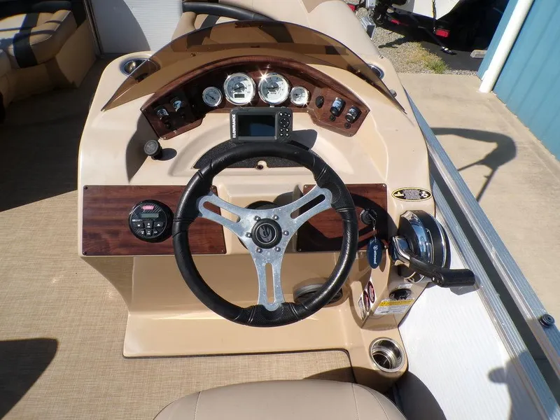Slide: The Image of 2018 Crestliner 220 RALLY boat dashboard with steering wheel and instrument panel. - 10