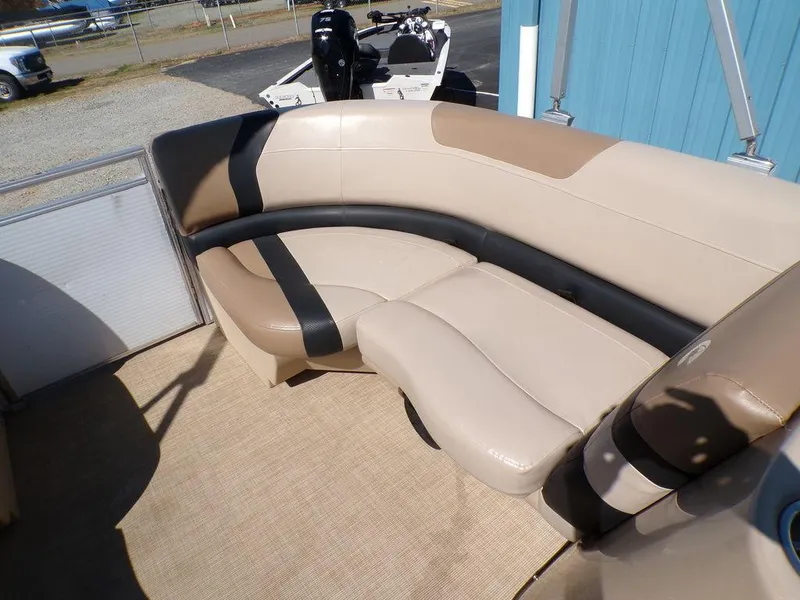 Slide: The Image of 2018 Crestliner 220 RALLY boat interior with beige and black seating. - 12