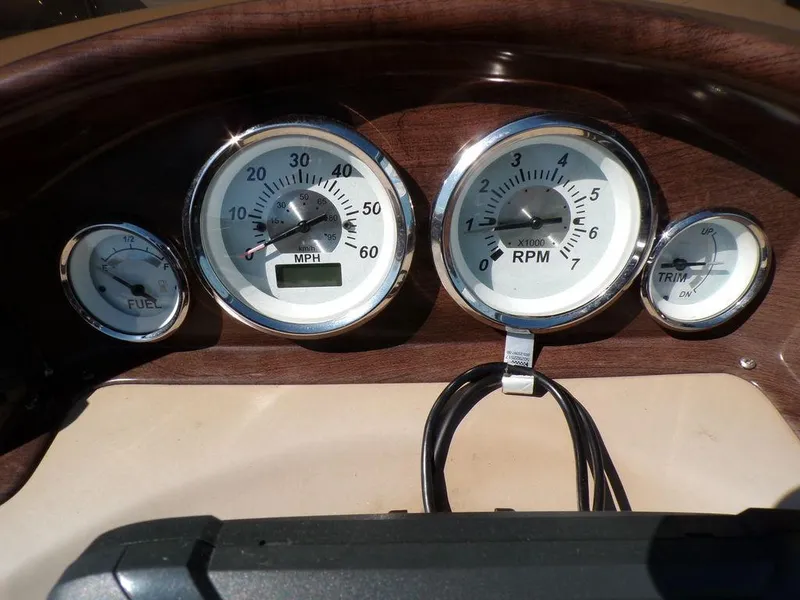 Slide: The Image of Dashboard of 2018 Crestliner 220 RALLY with speedometer, RPM, fuel, and trim gauges. - 9