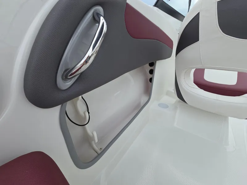 Slide: The Image of Interior of 2019 Tahoe 500 TF boat with maroon and gray accents. - 22