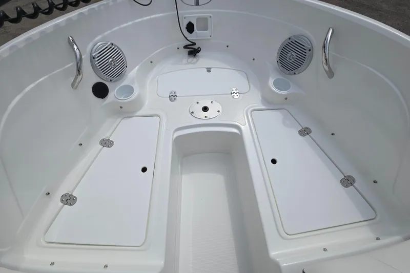 Slide: The Image of 2019 Tahoe 500 TF boat interior with storage compartments and speakers. - 23