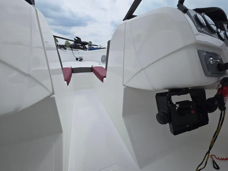 Slide: The Image of 2019 Tahoe 500 TF boat interior with white seating and control panel. - 28