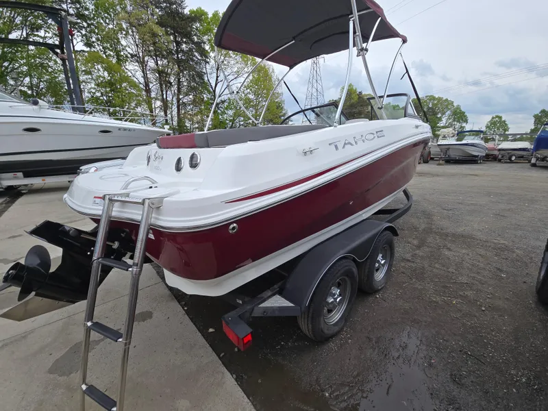 Slide: The Image of 2019 Tahoe 500 TF boat on trailer, red and white, with canopy and ladder. - 3