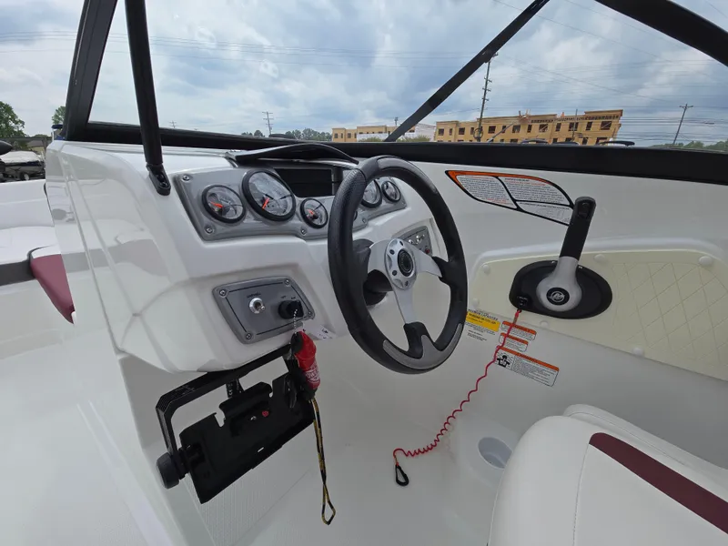 Slide: The Image of 2019 Tahoe 500 TF boat dashboard with steering wheel and control panel. - 31