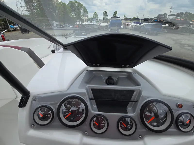 Slide: The Image of Dashboard of a 2019 Tahoe 500 TF boat with gauges and controls. - 34