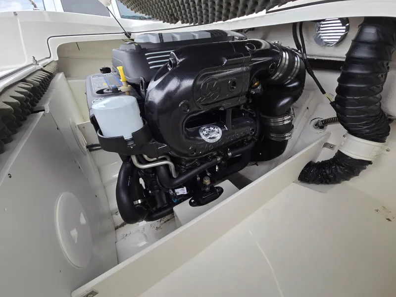 Slide: The Image of Engine compartment of a 2019 Tahoe 500 TF boat, showcasing detailed mechanical components. - 40