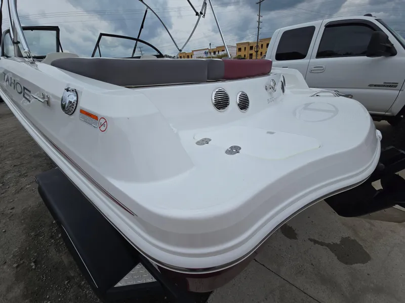 Slide: The Image of 2019 Tahoe 500 TF boat rear view with white exterior and seating. - 6