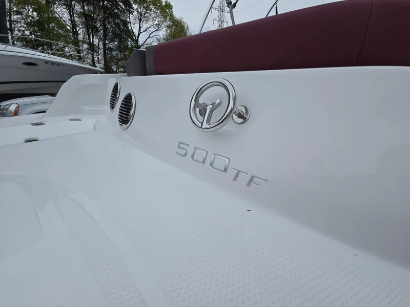 Slide: The Image of 2019 Tahoe 500 TF boat, white exterior with logo and model name visible. - 8