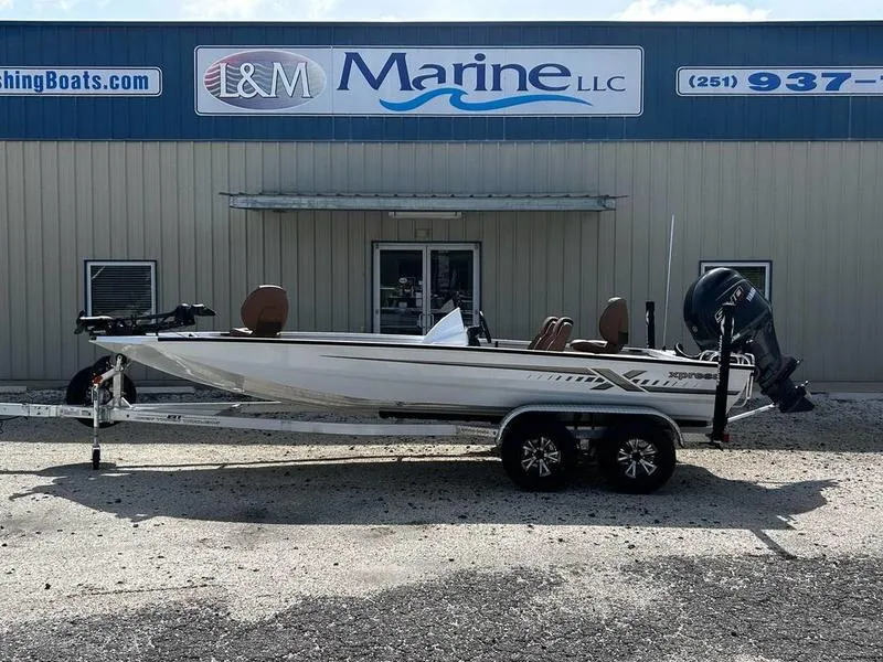 Slide: The Image of 2025 Xpress H20 Crappie boat on trailer outside L&M Marine LLC building. - 0