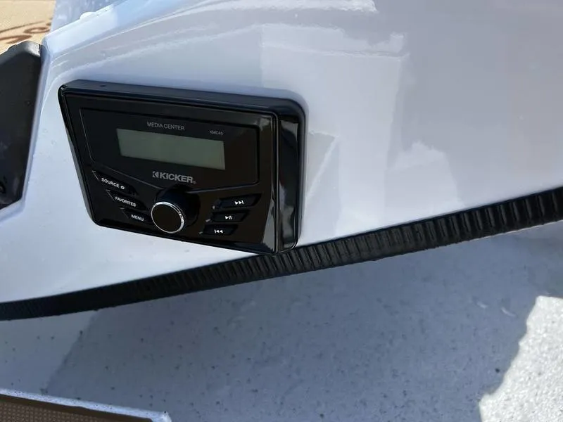 Slide: The Image of 2025 Xpress H20 Crappie boat with Kicker media center installed on the dashboard. - 14
