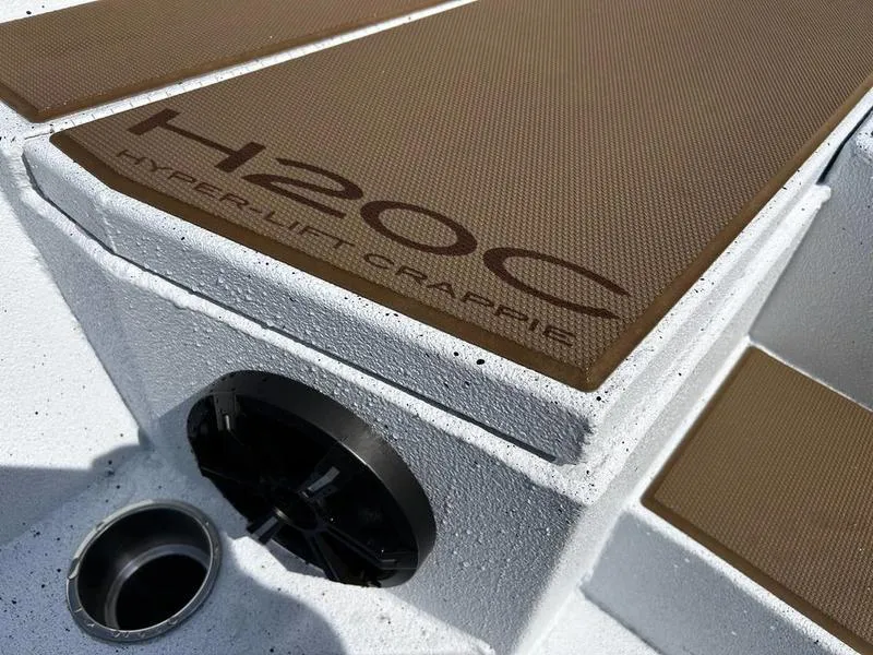 Slide: The Image of 2025 Xpress H20 Crappie boat deck with Hyper-Lift design, featuring brown textured surface. - 15