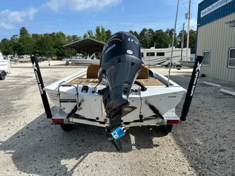 Slide: The Image of 2025 Xpress H20 Crappie boat with Yamaha engine, parked outdoors. - 6