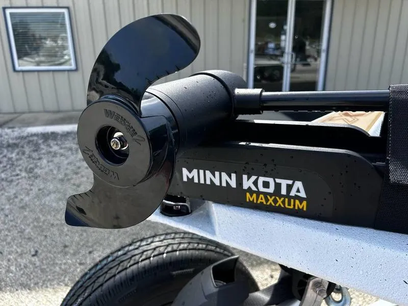 Slide: The Image of Minn Kota Maxxum motor on 2025 Xpress H20 Crappie boat, close-up view. - 7