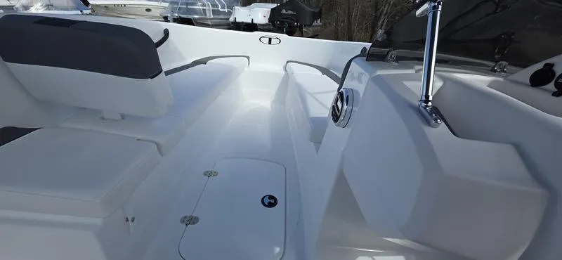 Slide: The Image of 2025 Tahoe T16 boat interior with white seating and sleek design. - 11