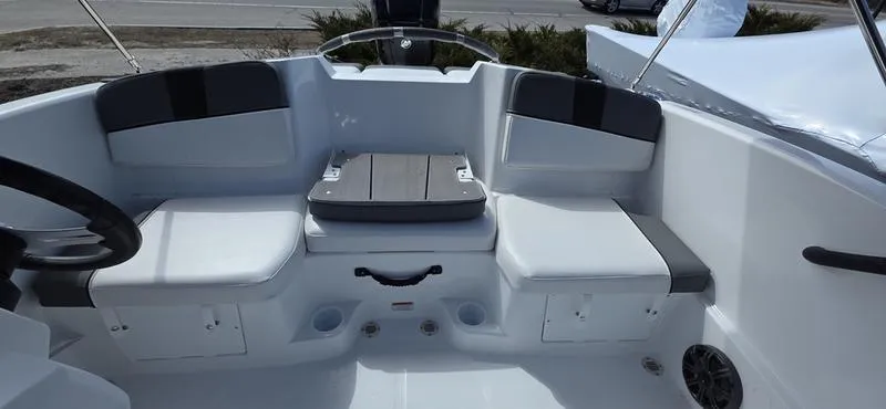 Slide: The Image of Interior of 2025 Tahoe T16 boat with white seating and storage compartments. - 13