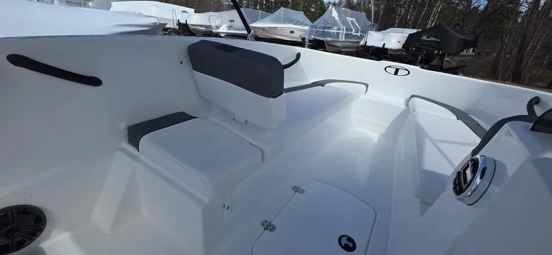 Slide: The Image of 2025 Tahoe T16 boat interior with seating and steering wheel, showcasing modern design. - 14