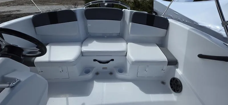 Slide: The Image of 2025 Tahoe T16 boat interior with white and gray seating arrangement. - 15