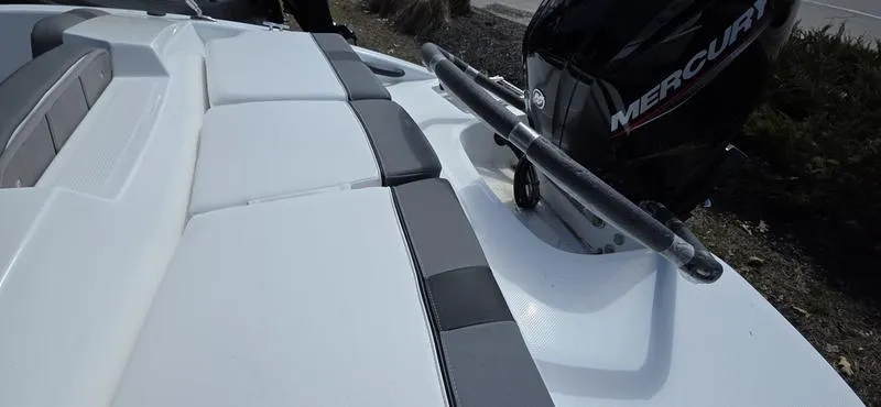 Slide: The Image of 2025 Tahoe T16 boat with Mercury engine, featuring sleek white and gray seating. - 6