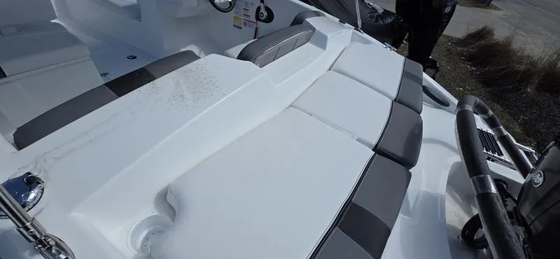 Slide: The Image of 2025 Tahoe T16 boat interior with white and gray seating. - 8