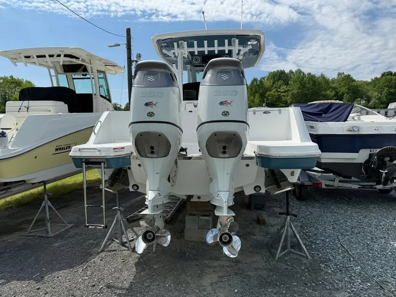 Slide: The Image of 2024 Crevalle 33 CSF boat with dual outboard engines on display. - 4