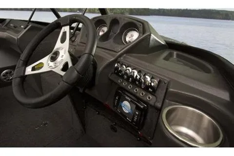 Slide: The Image of 2023 Alumacraft Trophy 185 dashboard with steering wheel and control panel. - 16