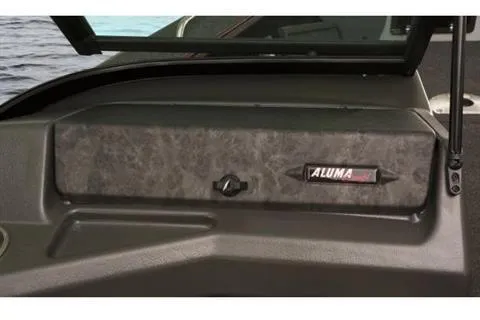 Slide: The Image of 2023 Alumacraft Trophy 185 dashboard detail with logo, near water. - 17