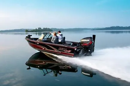 Slide: The Image of 2023 Alumacraft Trophy 185 boat speeding on a calm lake. - 18