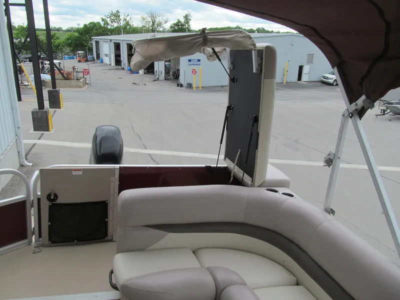 Slide: The Image of 2014 Sun Tracker Party Barge 20 DLX interior with seating and storage area. - 10
