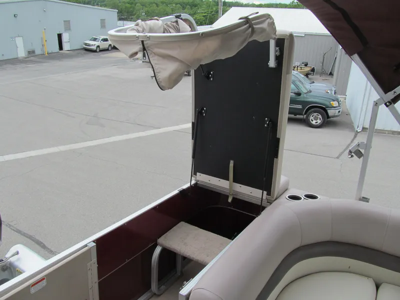 Slide: The Image of 2014 Sun Tracker Party Barge 20 DLX interior with seating and storage area. - 11