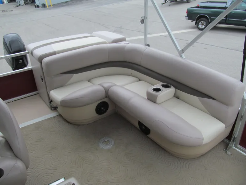 Slide: The Image of 2014 Sun Tracker Party Barge 20 DLX interior seating with cup holders. - 9