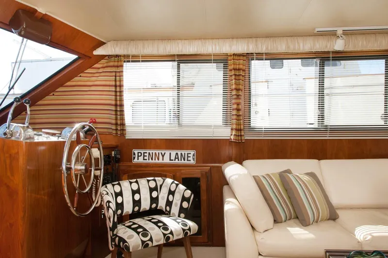 Slide: The Image of Interior of 1986 Californian 55 Cockpit Motor Yacht with stylish seating and nautical decor. - 10