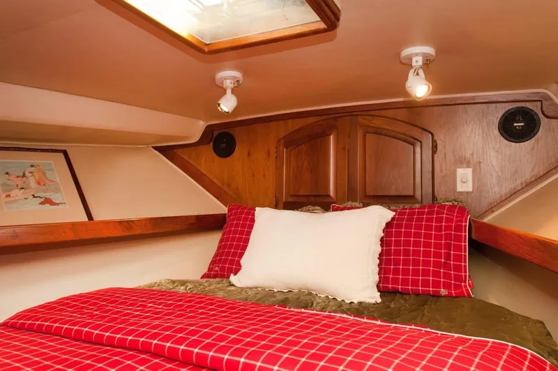 Slide: The Image of Cozy cabin interior of 1986 Californian 55 Cockpit Motor Yacht with red plaid bedding. - 15