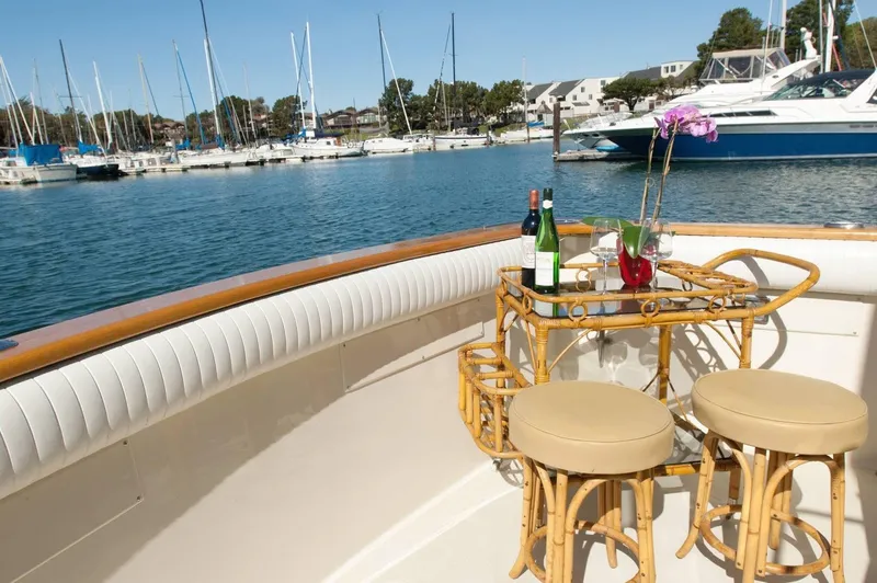 Slide: The Image of 1986 Californian 55 Cockpit Motor Yacht with elegant seating and marina view. - 3